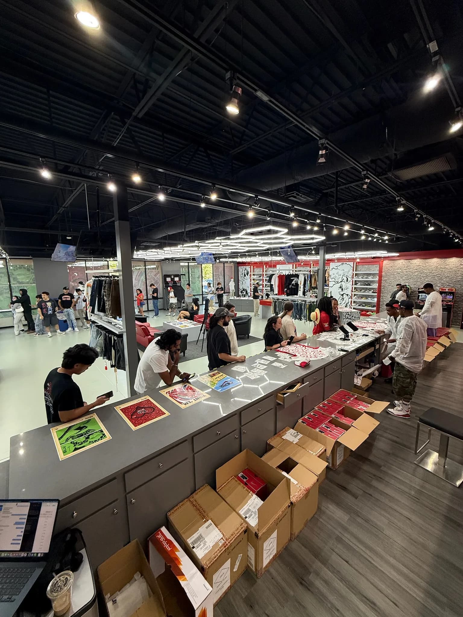 Customers and the checkout team inside Sole Play during the Nike × One Piece release